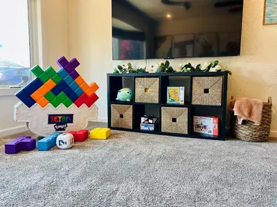 a childs room with a shelf with toys on the floor at Granite Hills Sunset Villa in El Cajon
