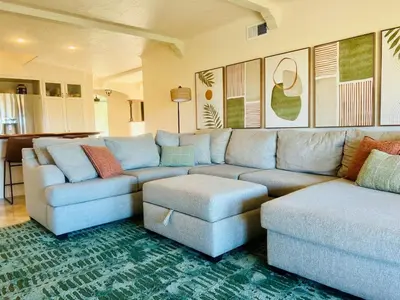 a living room with a couch and a table at Granite Hills Sunset Villa in El Cajon