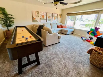 a living room with a pool table in it at Granite Hills Sunset Villa in El Cajon
