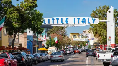 a street sign for little italy on a busy city street at Entire Private Home with 2 Bedrooms 1 Bathroom, Gated Yard, Driveway Parking, Available Now in Spring Valley