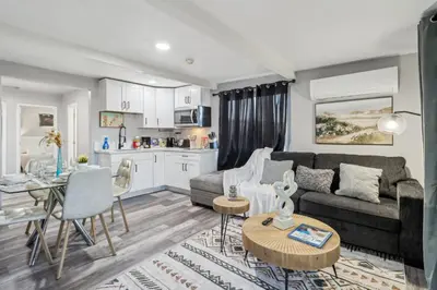 a living room with a couch and a table at Entire Private Home with 2 Bedrooms 1 Bathroom, Gated Yard, Driveway Parking, Available Now in Spring Valley