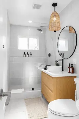 a bathroom with a sink and a tub and a mirror at Carlsbad Bungalow Large Backyard in Carlsbad