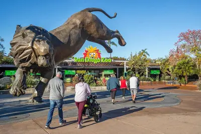a group of people walking past a statue of a lion at Charming La Mesa Cottage - Patio - Quiet Neighborhood - Family in La Mesa