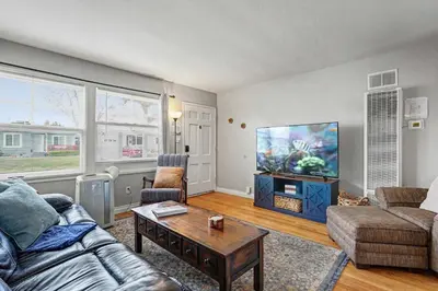 a living room with a couch and a tv at Charming La Mesa Cottage - Patio - Quiet Neighborhood - Family in La Mesa