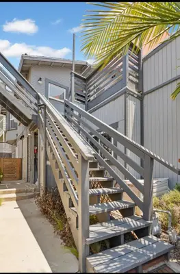 a set of stairs leading to a house at The Downtown Carraige Flat in San Diego