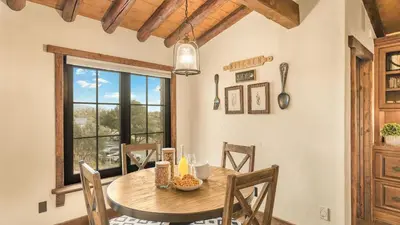 a dining room with a table and a window at Villa Di Gioia by AvantStay Private Wine-Country Estate Vineyard Views • Near Top Temecula Wineries in Temecula