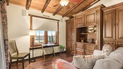 a living room with a couch and a table and a window at Villa Di Gioia by AvantStay Private Wine-Country Estate Vineyard Views • Near Top Temecula Wineries in Temecula
