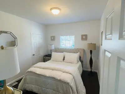 a white bedroom with a bed with white sheets at Amazing Ranch Home in Temecula wine country in Temecula