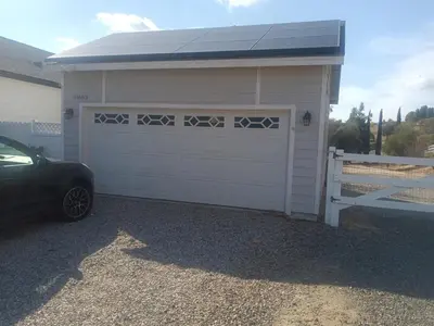 a garage with a car parked in front of it at Amazing Ranch Home in Temecula wine country in Temecula