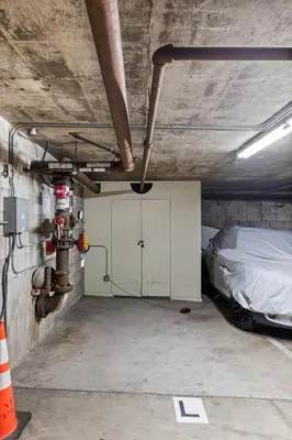 a garage with a car parked in it at Sunset on Sail Bay - Beautiful 2 Bedroom Condo in San Diego