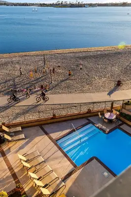 an overhead view of a beach with a swimming pool at Sunset on Sail Bay - Beautiful 2 Bedroom Condo in San Diego