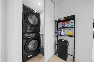 a laundry room with a washer and dryer at Entire Private Home with 3 Bedrooms 2 Bathrooms, with Garage, Gated Yard, King Bed House, Available Now in El Cajon