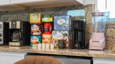 a counter with coffee products and a blender on it at Entire Private Home with 3 Bedrooms 2 Bathrooms, with Garage, Gated Yard, King Bed House, Available Now in El Cajon