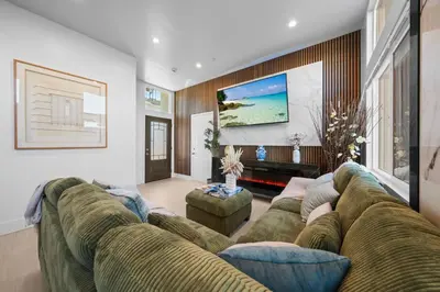 a living room with a large couch and a tv at Entire Private Home with 3 Bedrooms 2 Bathrooms, with Garage, Gated Yard, King Bed House, Available Now in El Cajon