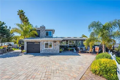 a house with a brick driveway with a garage at Panoramic view in San Marcos