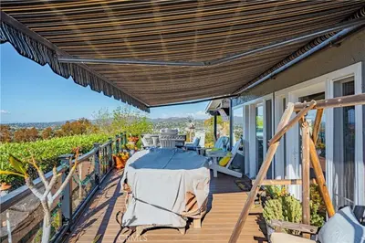 a wooden deck with a table on top of a house at Panoramic view in San Marcos