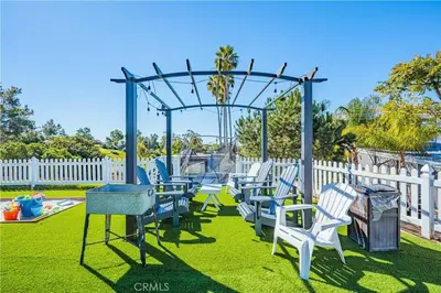 a playground with blue and white chairs and a swing at Panoramic view in San Marcos