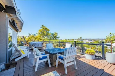 a patio with a table and chairs on a deck at Panoramic view in San Marcos