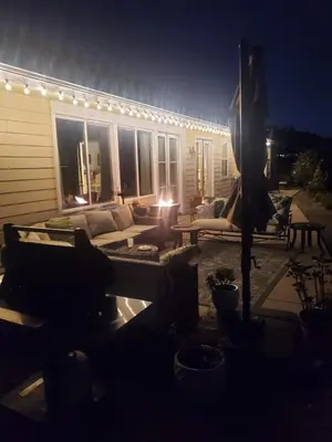 a backyard patio at night with a couch and lights at Beverlys Hilltop Retreat in Fallbrook