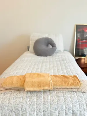 a doughnut sitting on top of a bed at 6BR5BA Hot Tub Steps to Beach Parking Pet Friendly in San Diego