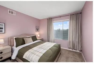 a bedroom with a large bed and a window at Dream vacation home in Laguna Hills