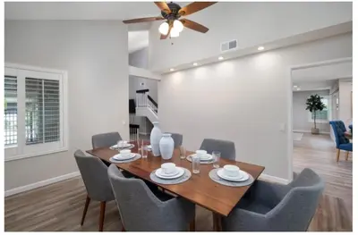 a dining room with a wooden table and chairs at Dream vacation home in Laguna Hills