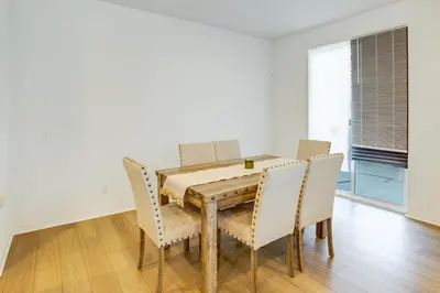 a dining room with a wooden table and chairs at Family Getaway with Pool, 8 Mi to Lake Elsinore! in Wildomar