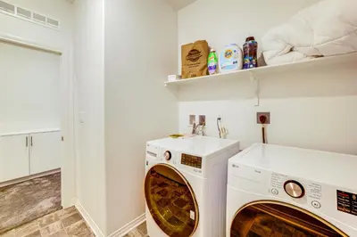 a laundry room with a washer and dryer at Family Getaway with Pool, 8 Mi to Lake Elsinore! in Wildomar