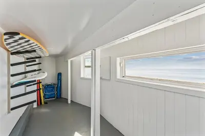 a room with a view of the ocean and a window at Oceanfront St Anns Beach Laguna Beach Private Beach Stairs To The Sand in Laguna Beach