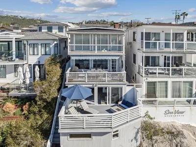 an aerial view of a large white house at Oceanfront St Anns Beach Laguna Beach Private Beach Stairs To The Sand in Laguna Beach