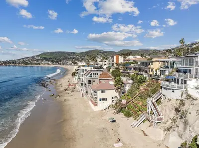 an aerial view of a beach with buildings at Oceanfront St Anns Beach Laguna Beach Private Beach Stairs To The Sand in Laguna Beach