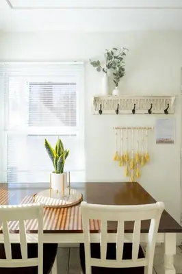 a dining room with a table and two chairs at Boho Chic Cottage Walk to Cafes Outdoor Lounge in San Diego