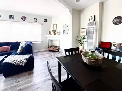a living room with a table and a couch at A Walkable Music-Themed Escape Near Downtown in San Diego