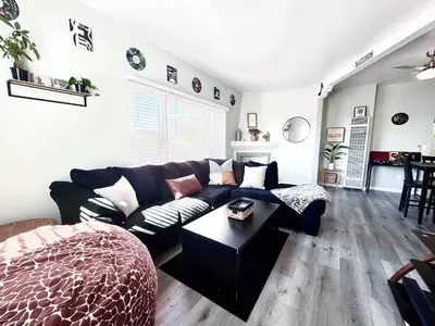 a living room with a couch and a table at A Walkable Music-Themed Escape Near Downtown in San Diego