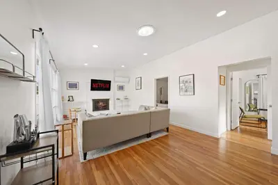 a large living room with a couch and a fireplace at Stylish Retreat Near Mission Bay with Games & Firepit in San Diego