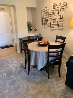 a table with chairs and a bowl of fruit on it at Exclusive Top Floor 1 bedroom in central Irvine one month min in Irvine