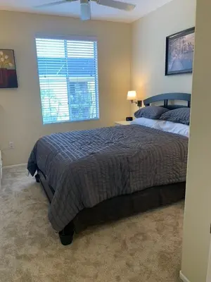a bedroom with a large bed and a window at Exclusive Top Floor 1 bedroom in central Irvine one month min in Irvine