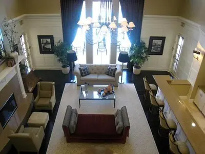 a living room with a dog laying on a table at Exclusive Top Floor 1 bedroom in central Irvine one month min in Irvine