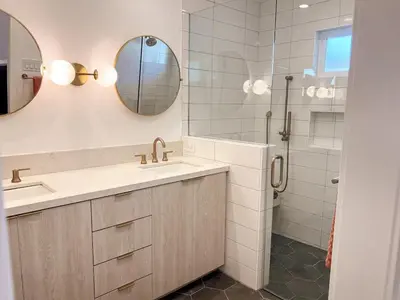 a bathroom with a sink and a shower at Luxury 3BR, 2BA Newly Renovated with Huge Backyard in San Diego