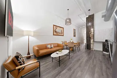 a living room with a couch and a table at Central Downtown Apt Sleeps 8 & Enjoy Gaslamp in San Diego