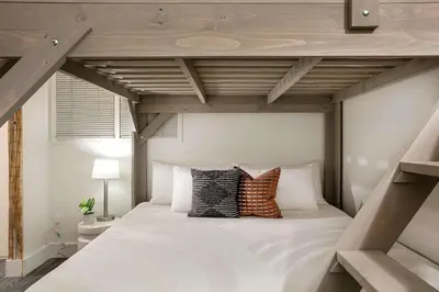 a loft bed with pillows on it in a bedroom at Central Downtown Apt Sleeps 8 & Enjoy Gaslamp in San Diego