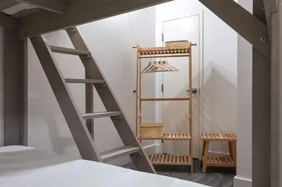 a room with a ladder and a mirror at Central Downtown Apt Sleeps 8 & Enjoy Gaslamp in San Diego