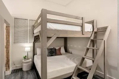 a bedroom with two bunk beds and a ladder at Central Downtown Apt Sleeps 8 & Enjoy Gaslamp in San Diego