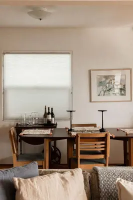a living room with a table and a window at Water & Downtown Views Close to beach Villa in San Diego