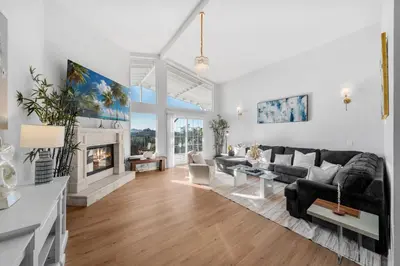 a living room with a couch and a fireplace at Entire Private Home with 4 Bedrooms 2 Bathrooms, Pool, View, 4 Parking, King Bed, Big Yard, Available Now in El Cajon