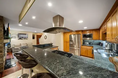 a kitchen with a large counter top in a room at Steps to Sand - Pacific Beach 3BR Townhome in San Diego