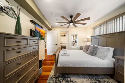 a bedroom with a bed and a ceiling fan at Steps to Sand - Pacific Beach 3BR Townhome in San Diego