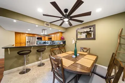 a dining room with a table and a ceiling fan at Steps to Sand - Pacific Beach 3BR Townhome in San Diego