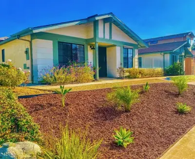 a house with a landscaping in front of it at Coastal cottage in Oceanside