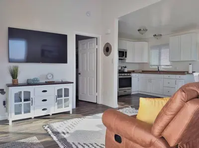 a living room with a couch and a kitchen at Stylish Relaxation-Panoramic Views-Private OASIS in El Cajon